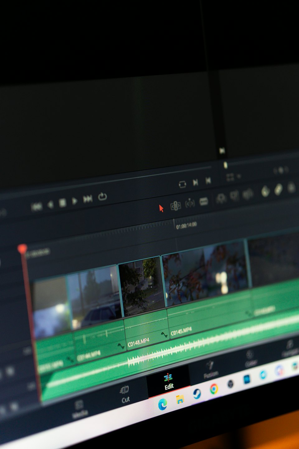 Computer screen showing video editing software timeline and interface.